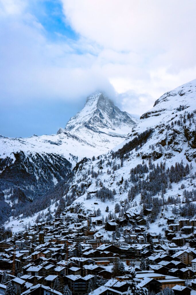 Snow-covered village of Zermatt with the Matterhorn rising behind it in winter